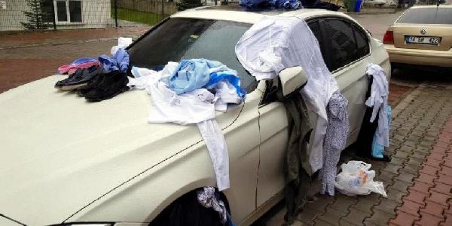 Eve gelmeyen eşinin kıyafetlerini otomobile bağlayıp not yazdı