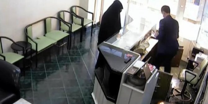 Kara çarşaflı soyguncuyu esnaf etkisiz hale getirdi