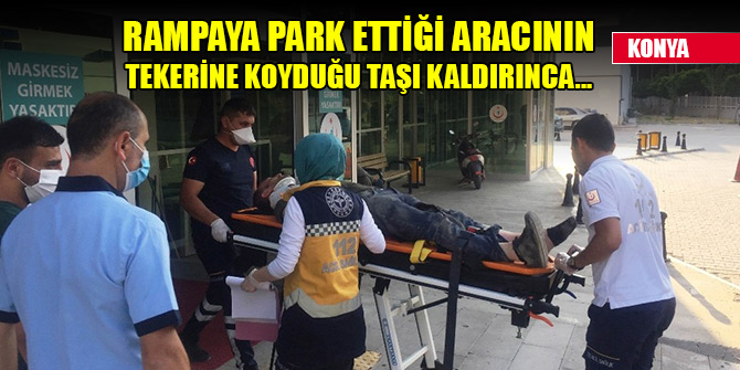 Rampaya park ettiği aracının tekerine koyduğu taşı kaldırınca bacağı ezildi