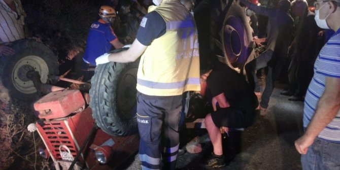 Devrilen traktörün altında kalan sürücü ölümden döndü