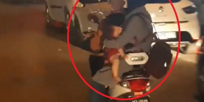 Elektrikli bisikletli çiftin bebekleriyle tehlikeli yolculuğu kamerada