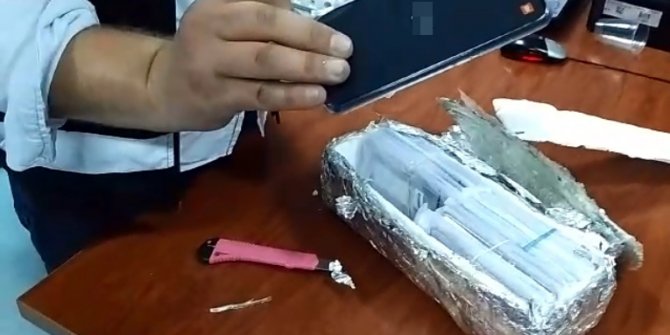 Otomobilin zulasından 146 kaçak cep telefonu çıktı
