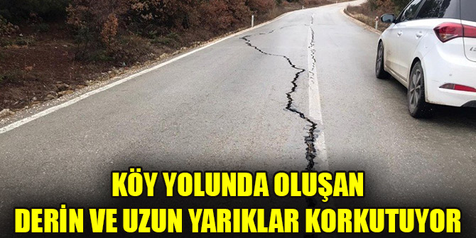 Köy yolunda oluşan derin ve uzun yarıklar korkutuyor