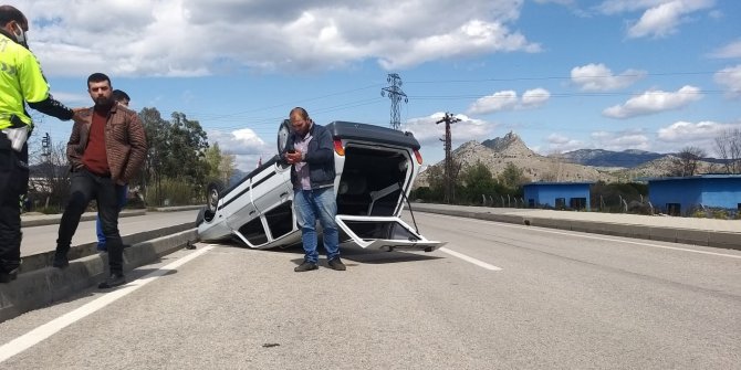 Takla atan otomobilden hafif yaralı kurtuldu