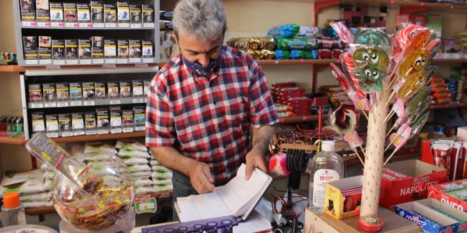 Konya'da bir hayırsever, bakkalın veresiye defterindeki 9 bin lira borcu ödedi